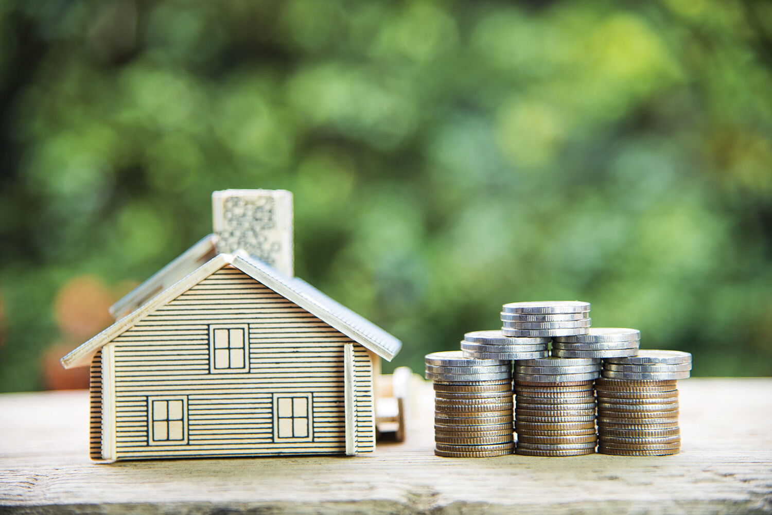 Coin,Stack,With,House,Model,,Savings,Plans,For,Housing,,green